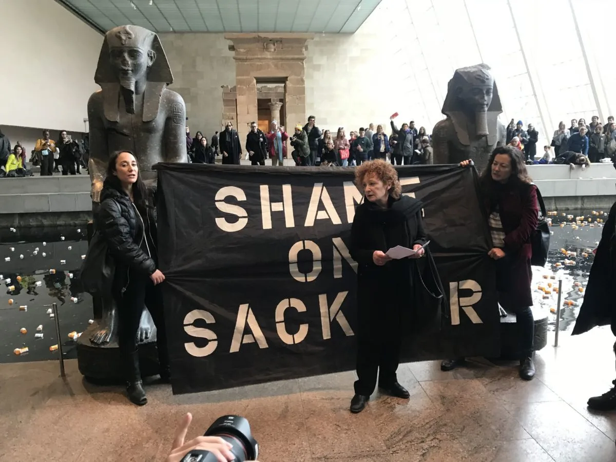 Nan Goldin speaking at the protest at the Met in 2018. Photo by Michael Quinn